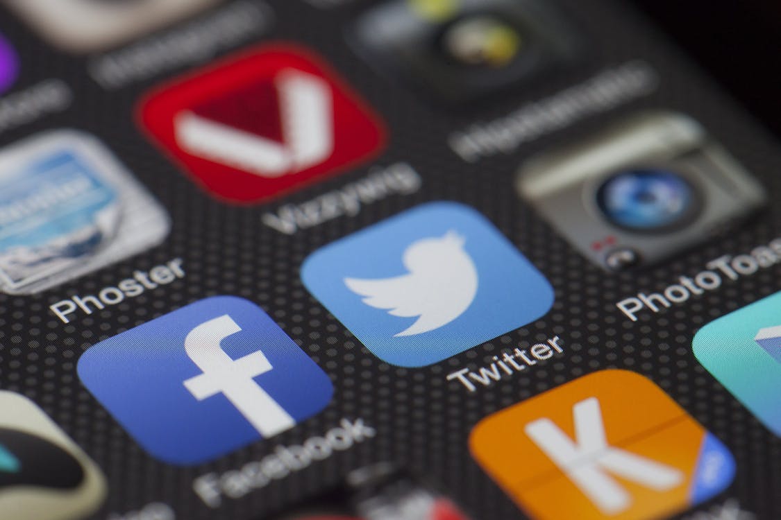 Social media platform icons on wooden letter tiles