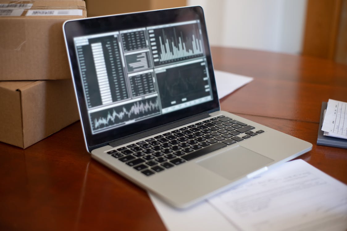 Person analyzing marketing analytics on a laptop
