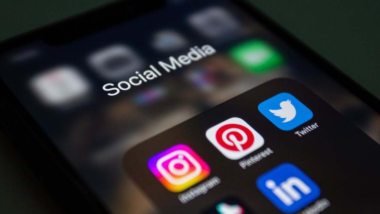 Person scrolling through social media on a smartphone