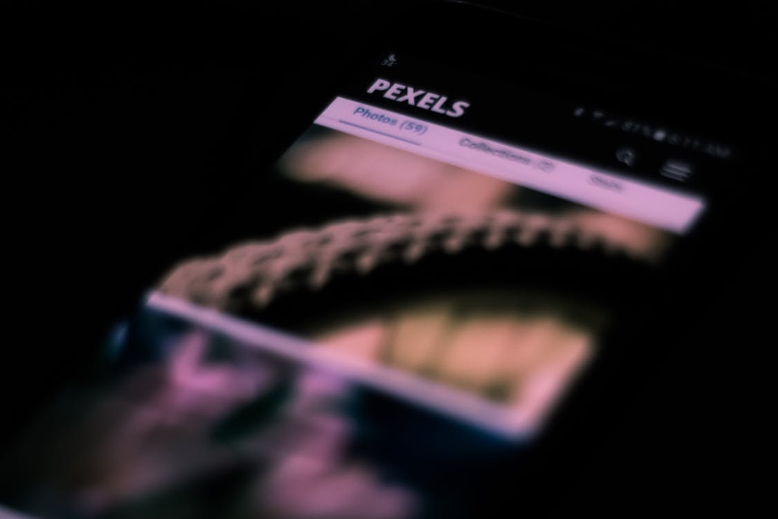 Hands holding a smartphone while browsing a website
